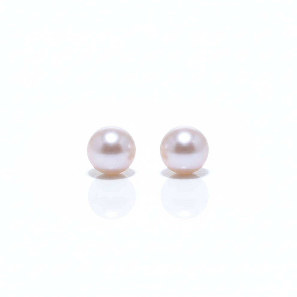 Pearl stud earrings front view on white background
