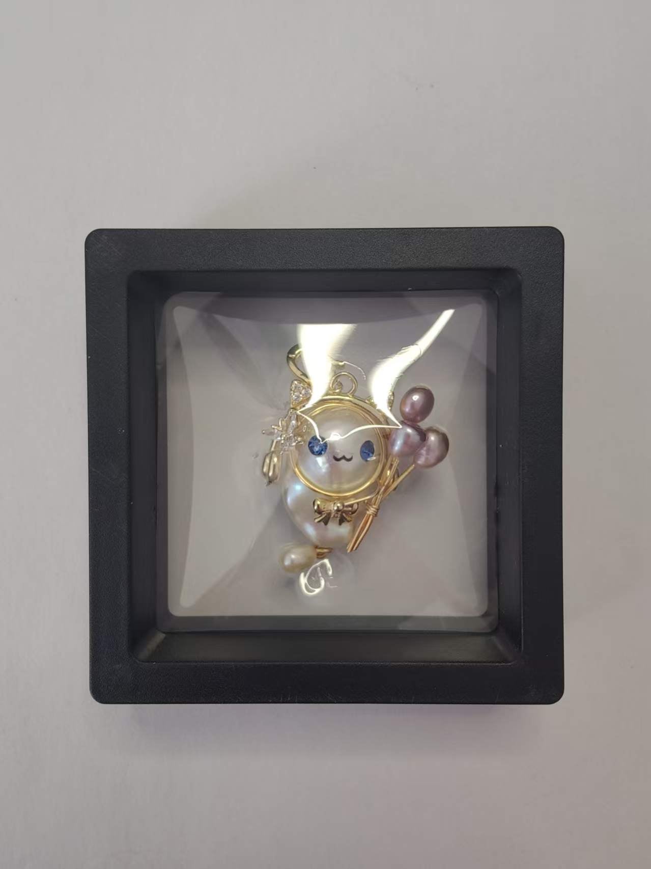 Baroque pearl statement pendant with cute character design in clear packing box