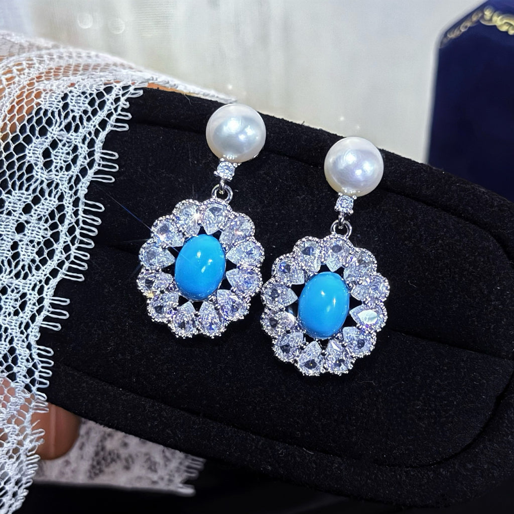 14K gold filled pearl and turquoise earrings on natural textured surface