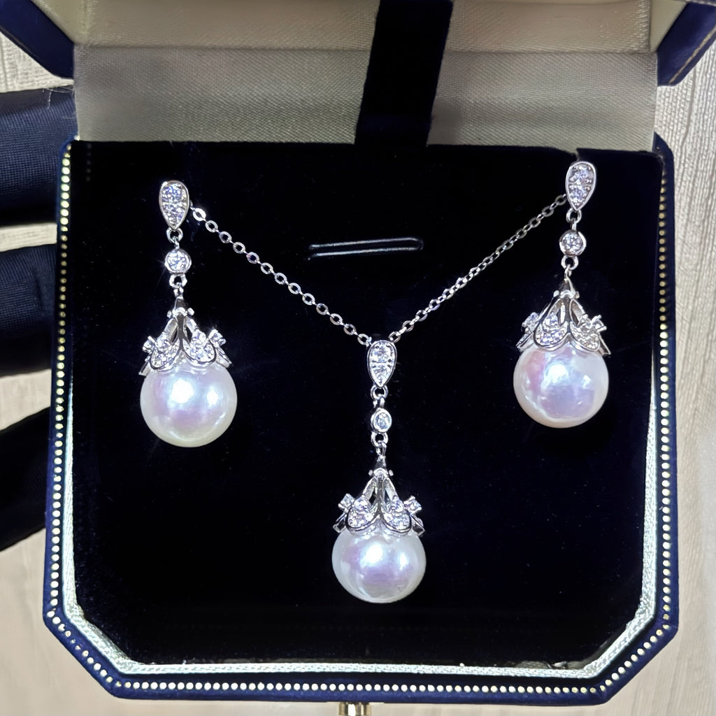 Pearl necklace and earrings set in a jewelry box