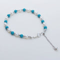 Pearl and turquoise beaded bracelet sterling silver on white background
