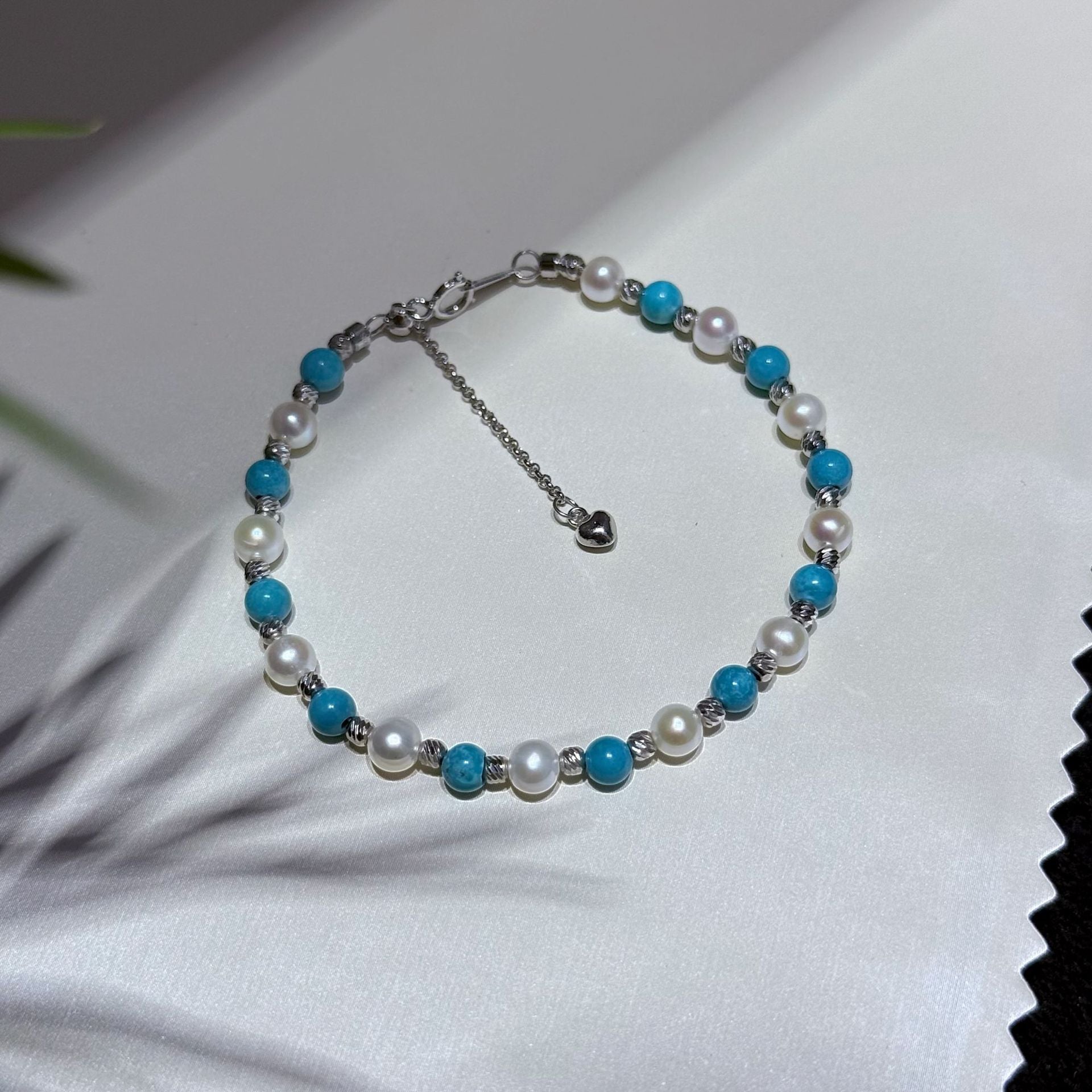 Close-up of sterling silver clasp and adjustable chain