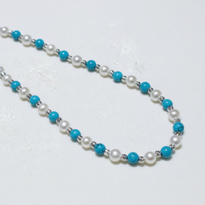 Pearl and turquoise beaded necklace sterling silver on white background