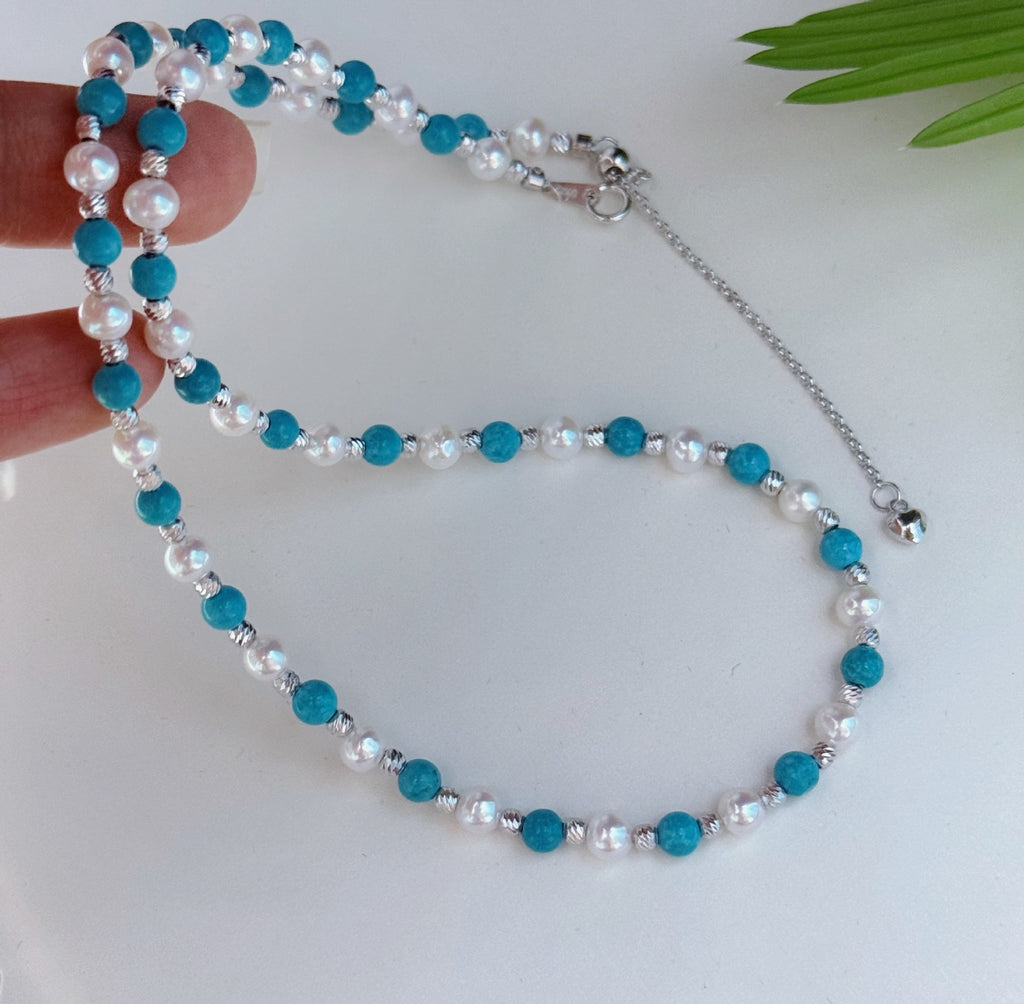 Pearl turquoise necklace photographed under natural light